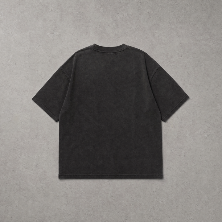 A dark charcoal gray short-sleeve t-shirt shown from the back, laid flat against a textured gray background.
