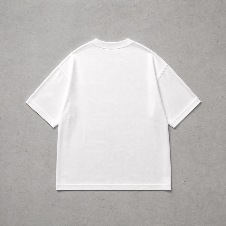 A plain white short-sleeve crewneck T-shirt shown from the back, laid flat on a textured gray background.